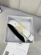 White leather belt with gold-tone rhinestone CC buckle in a presentation box