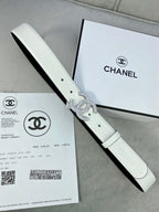 White leather belt with rhinestone CC buckle, shown with a side edge view