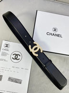 Black leather belt with rhinestone CC buckle and long strap, with a retail box nearby