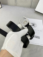 Black belt with rhinestone CC buckle detail and adjustable strap holes