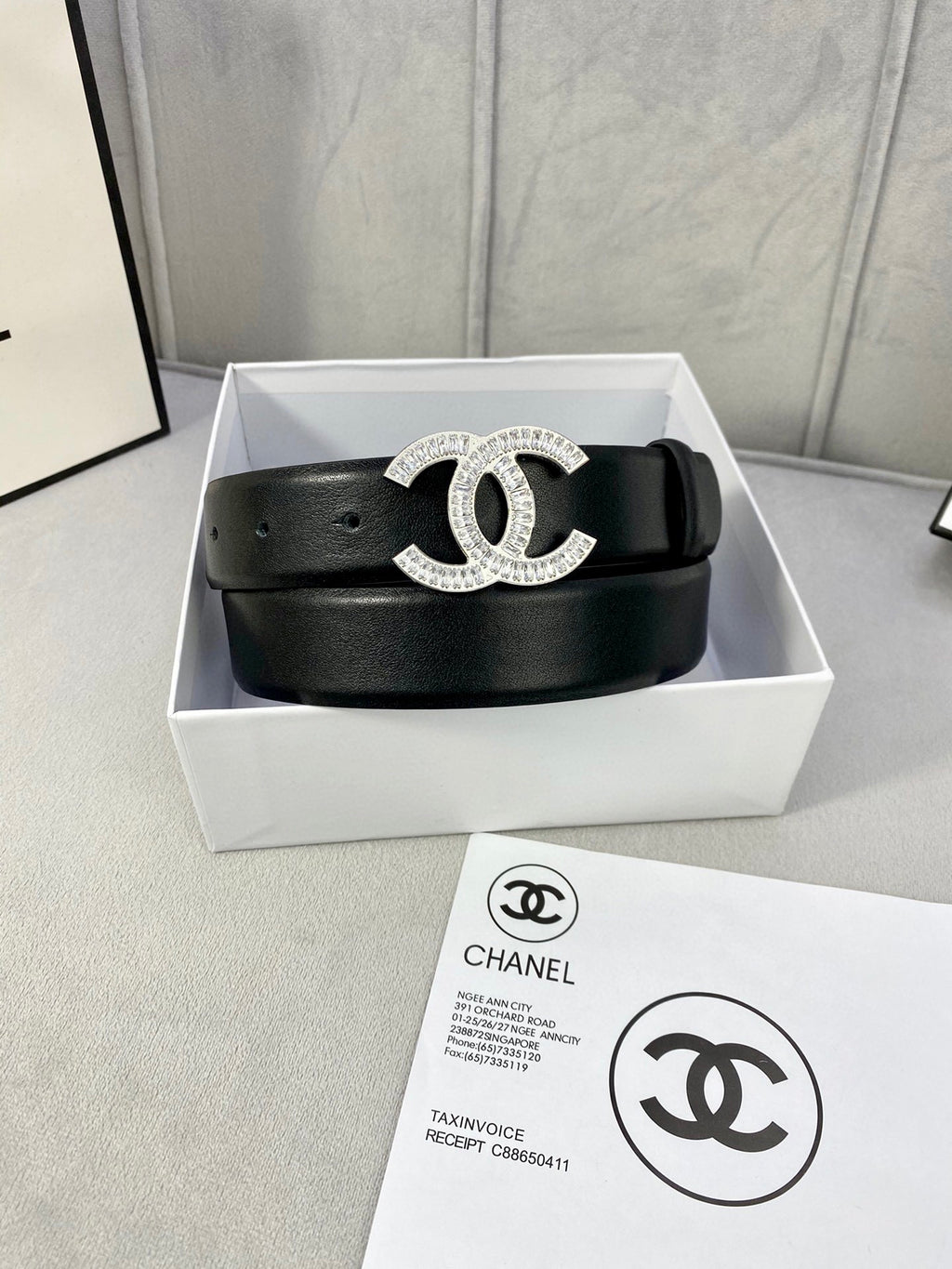 Black leather Chanel belt with rhinestone CC buckle in a presentation box