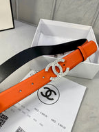 Chanel orange belt with crystal CC buckle on black backing