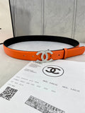 Chanel orange belt with black underside and crystal CC buckle, adjustable holes