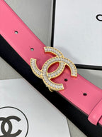 Chanel belt detail: pink strap with black lining and rhinestone CC buckle
