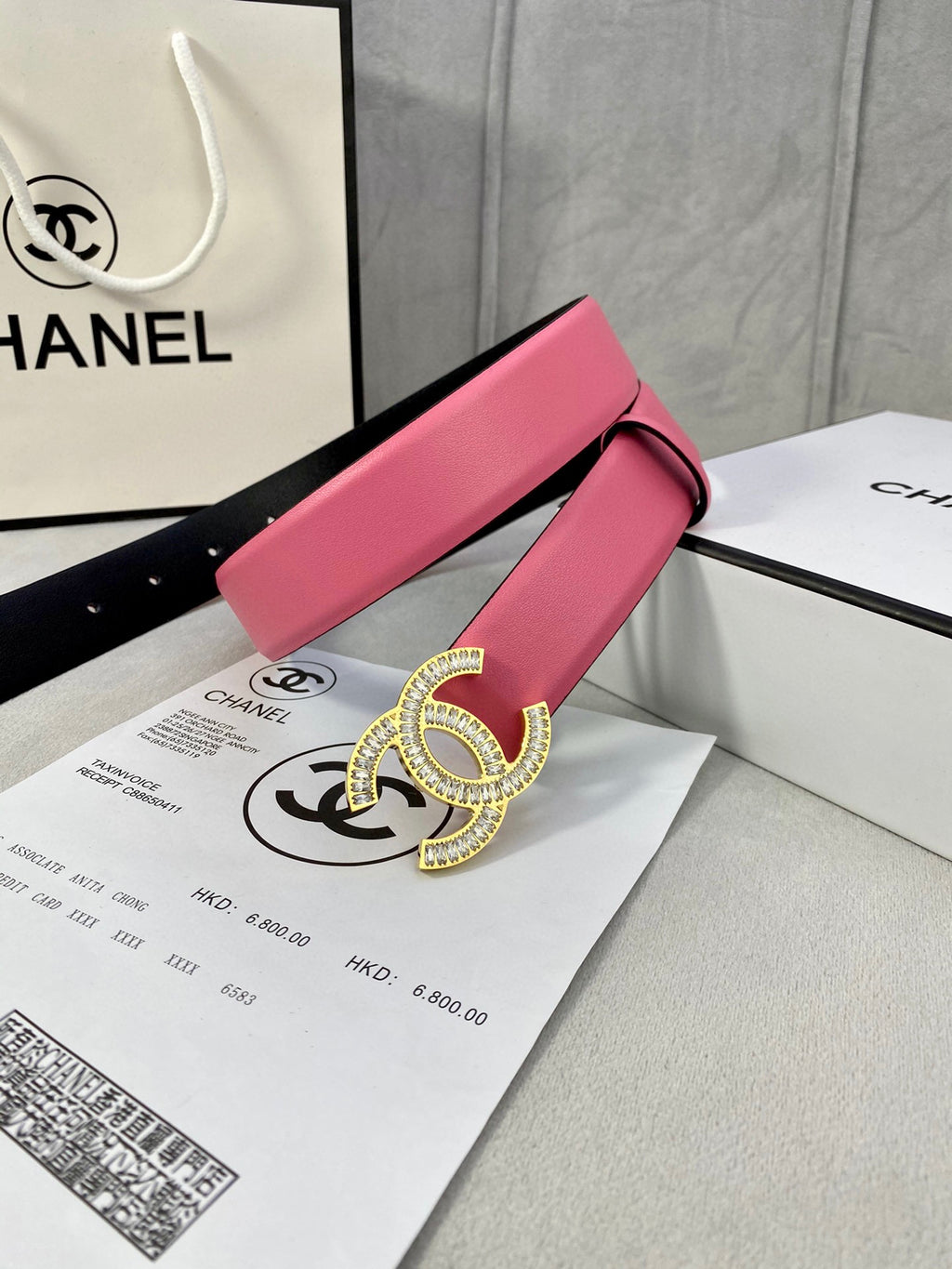 Chanel belt with pink leather strap and large rhinestone CC buckle