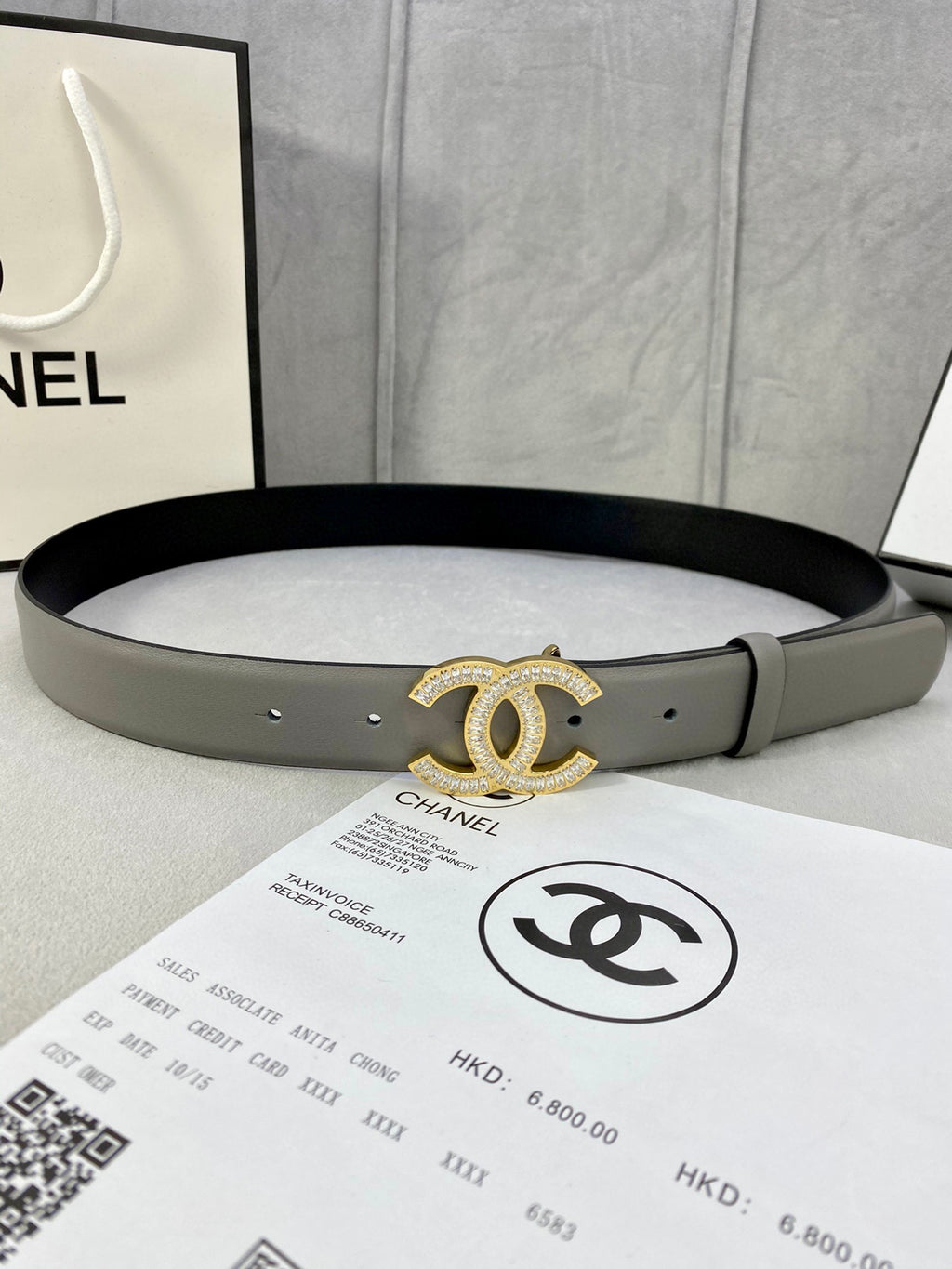 Chanel belt in light gray leather with gold-tone CC logo buckle and punched holes