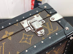 Studded monogram canvas bag clasp with silver lock plate on black leather.