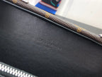 Louis Vuitton bag interior with embossed brand mark on black leather