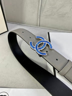 Grey leather belt with blue-and-gold CC buckle, front view