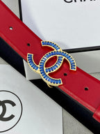 Blue-and-gold CC logo buckle on red leather belt with round pin holes