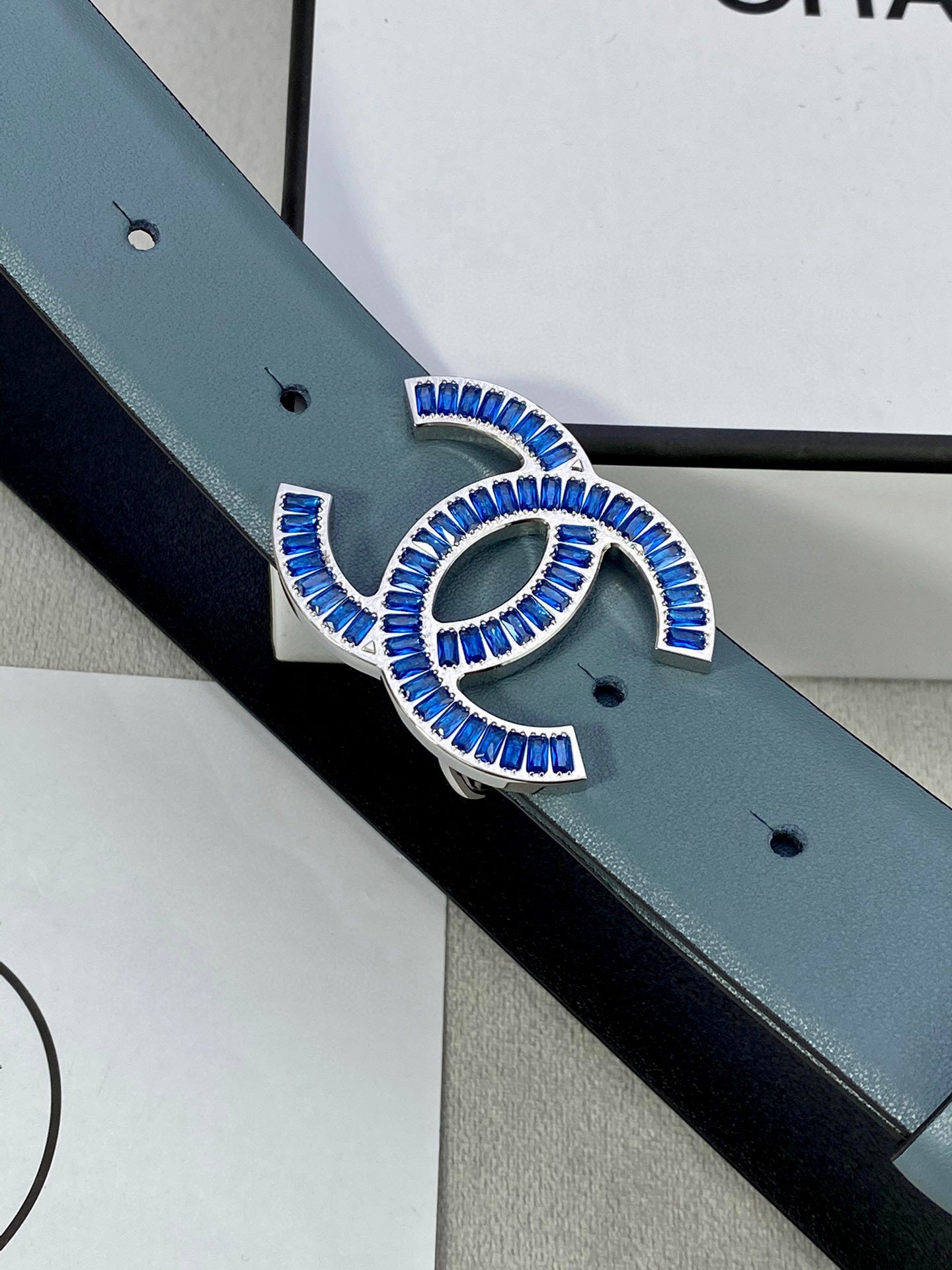 Chanel belt buckle with blue enamel CC design on light blue strap