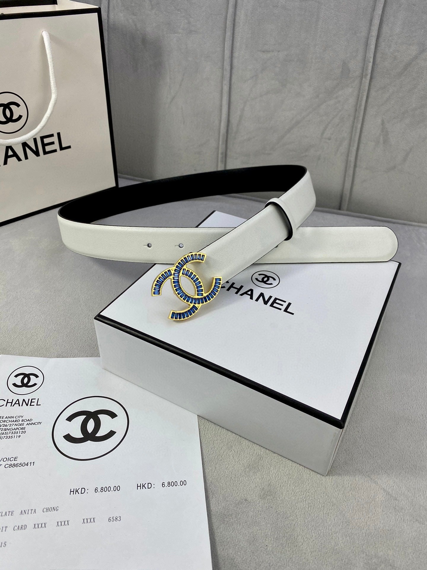 Chanel belt with light strap and blue jeweled CC buckle