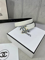 Chanel belt with light strap and blue jeweled CC buckle