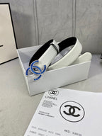 Chanel belt with light strap and blue jeweled CC buckle