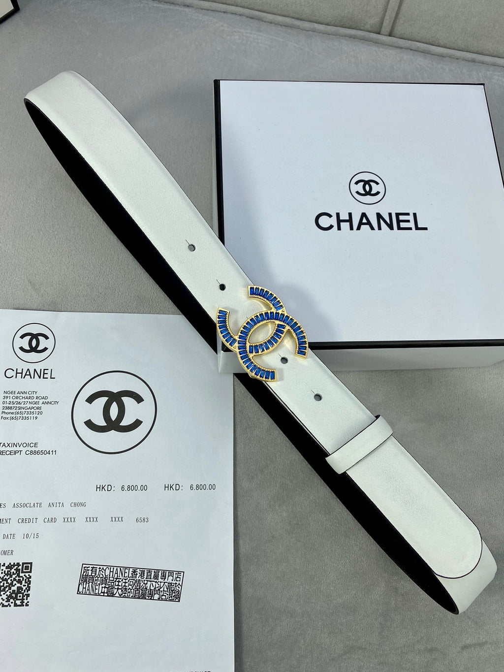 Chanel belt with light strap, blue jeweled CC buckle and punched holes