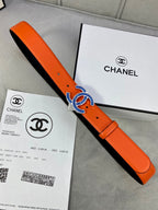 Orange leather belt with blue CC buckle and black lining