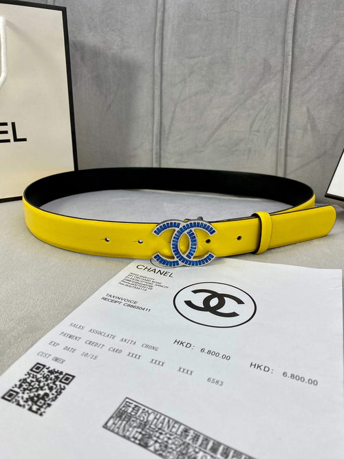 Yellow Chanel belt with blue CC logo buckle and black inner lining