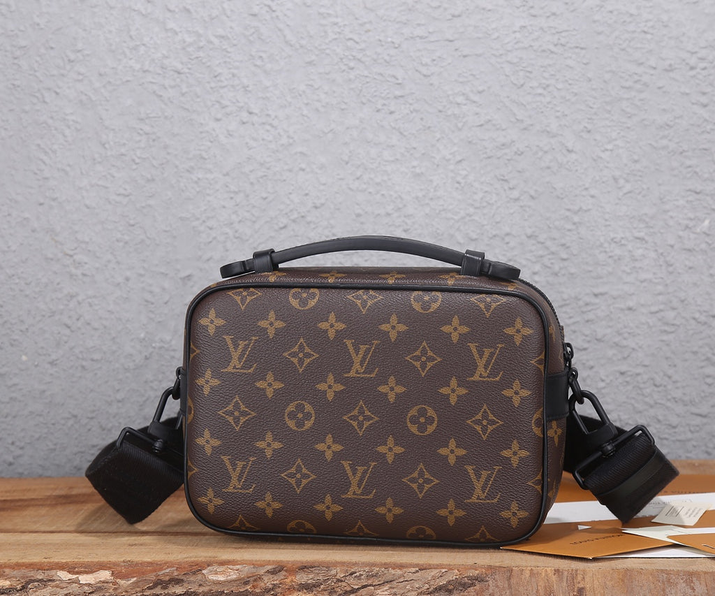 Louis Vuitton monogram crossbody bag with black shoulder strap and front panel
