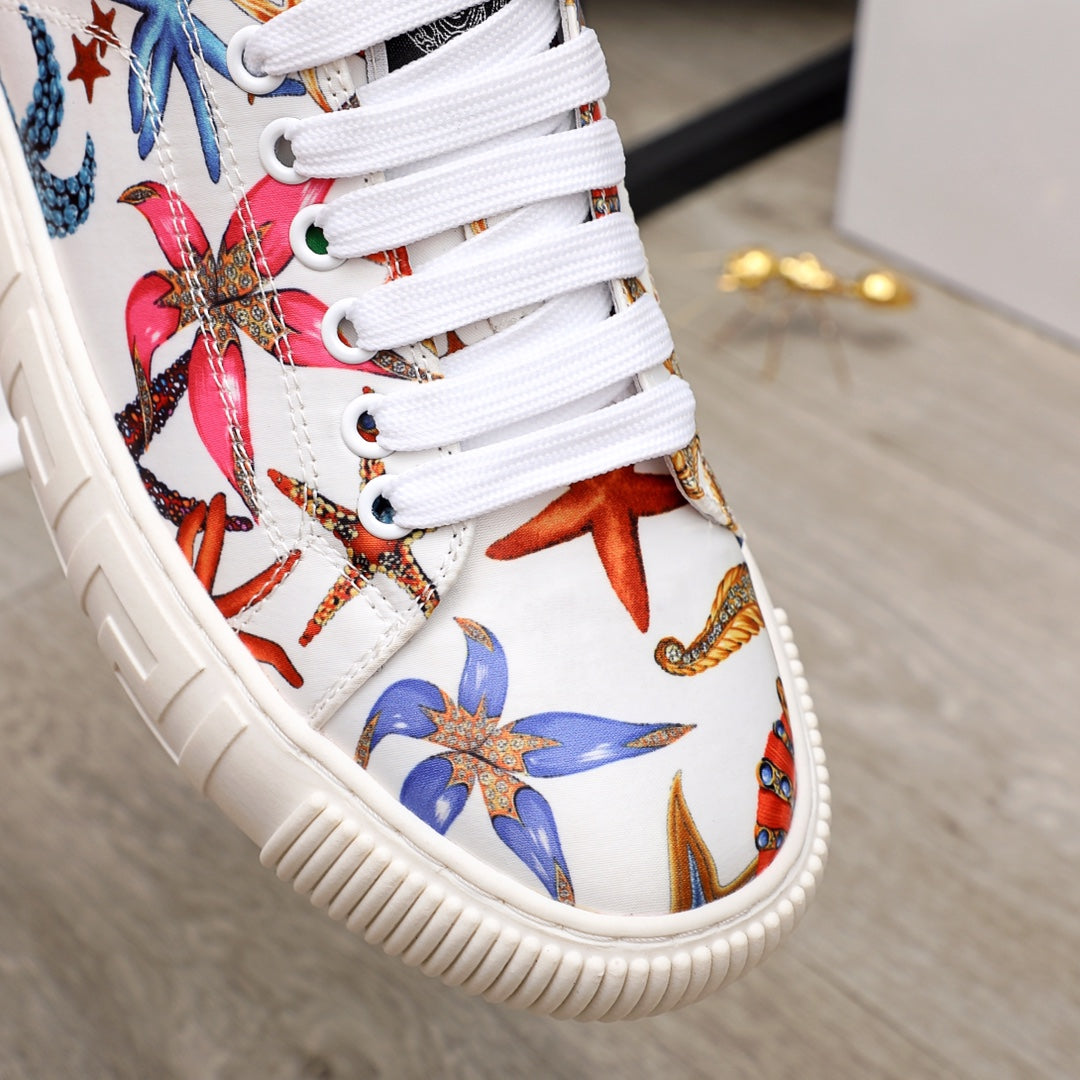 White sneaker upper with close-up multicolor sea-life embroidery, white laces and stitched trim.