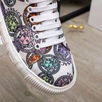 Versace sneakers close-up of multicolor patterned upper with white lace-up trim