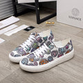 Versace sneakers in white with multicolor logo and character print, white laces