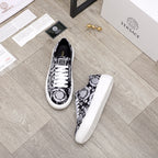 Versace luxury sneakers, pair view, black and white baroque print with white laces