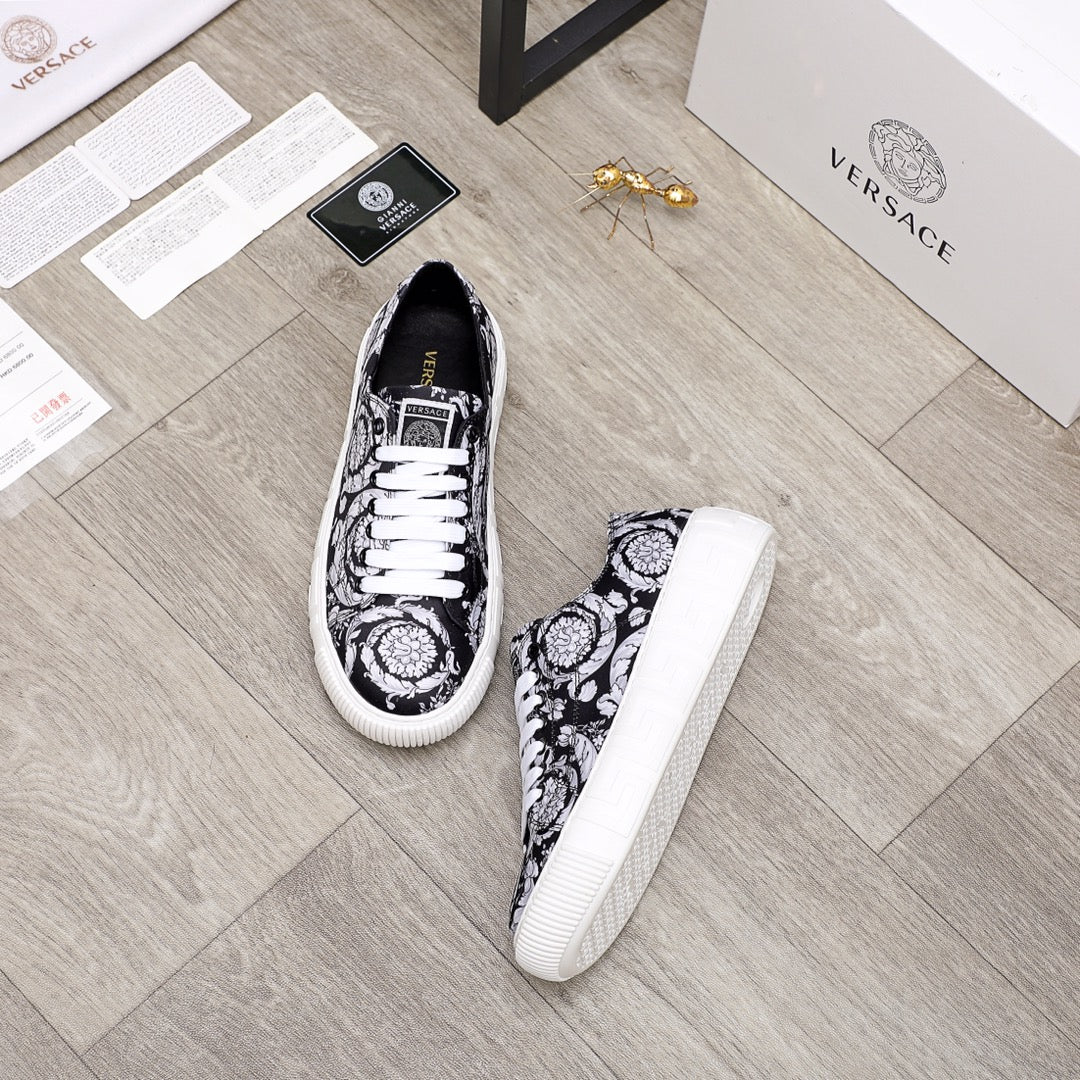 Versace luxury sneakers, pair view, black and white baroque print with white laces