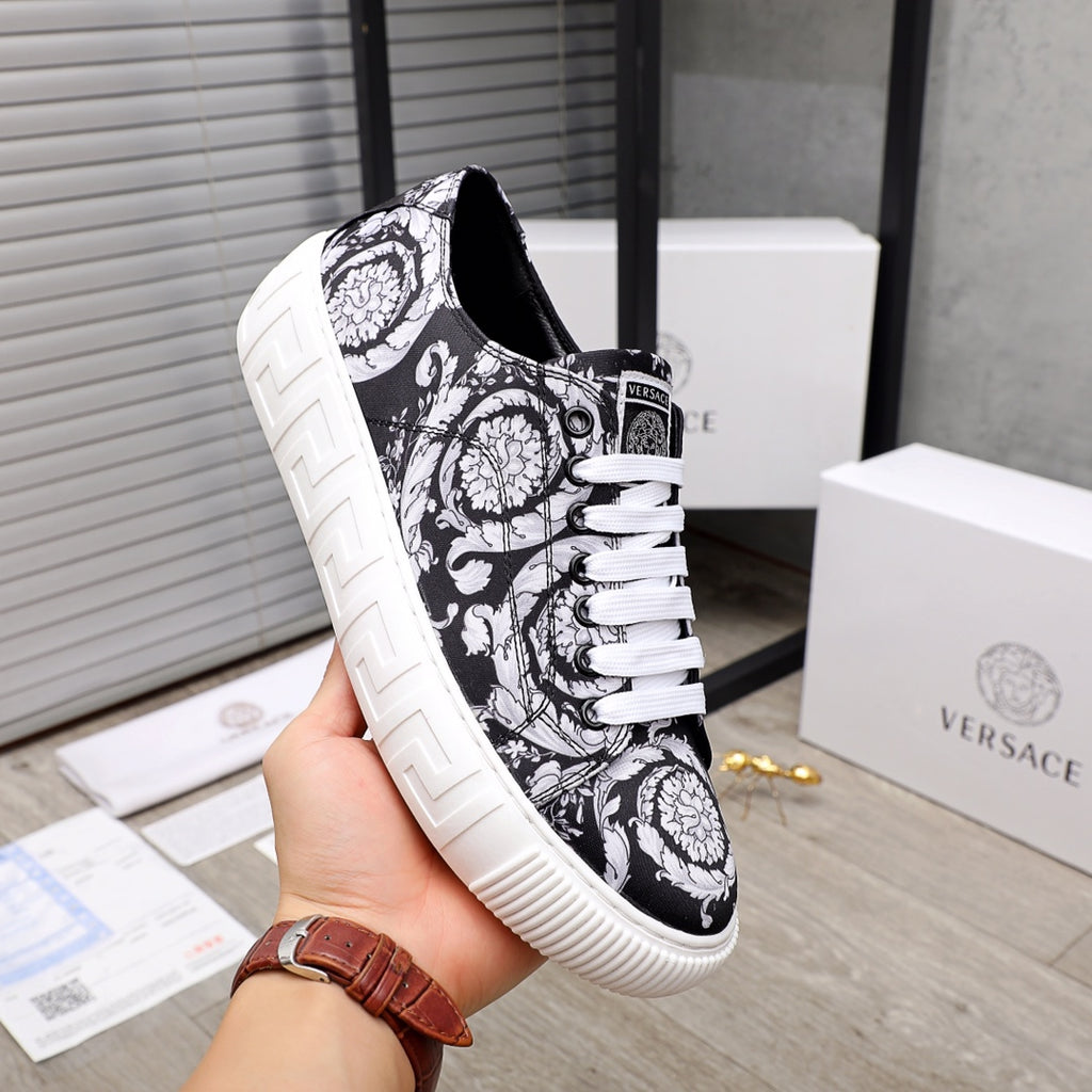 Versace luxury sneakers, side view, black and white baroque print with white rubber sole