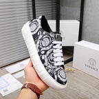 Versace luxury sneakers, side view, black and white baroque print with white rubber sole