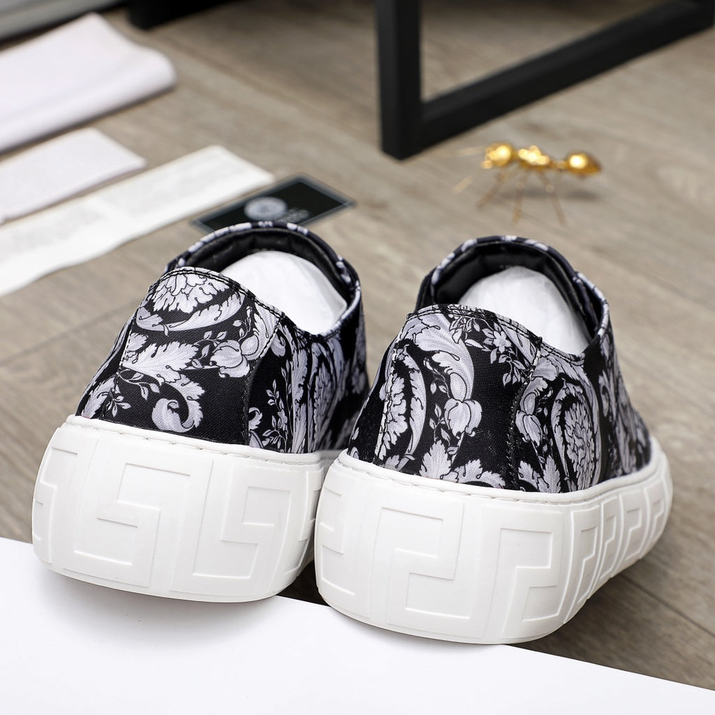 Versace luxury sneakers, rear view, black-and-white baroque uppers with white soles