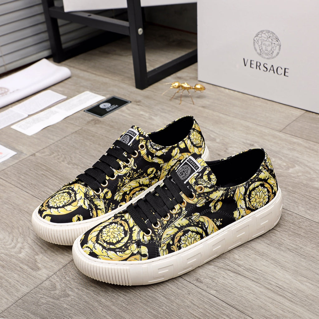 Versace luxury sneakers with black-and-yellow baroque print, black laces, white sole