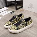 Versace luxury sneakers with black-and-yellow baroque print, black laces, white sole