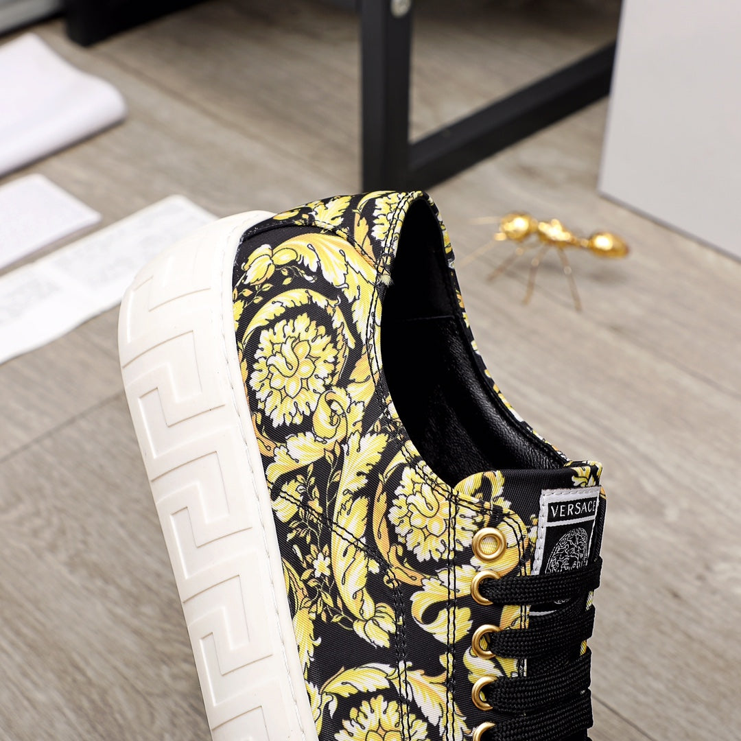 Versace luxury sneaker heel and side, black-and-yellow baroque print, black laces, white sole