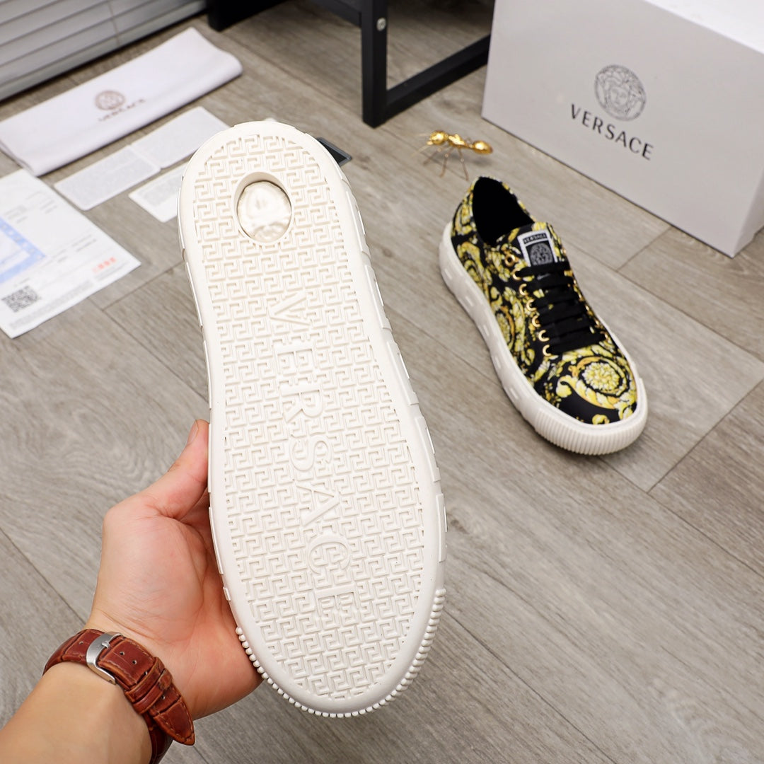 Versace luxury sneaker outsole detail, textured white sole with black-and-yellow upper