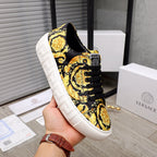 Versace luxury sneakers, black and gold baroque print, lace-up low top, white platform sole