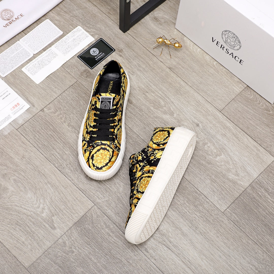 Versace luxury sneakers, black and gold baroque print, lace-up with white platform sole, pair