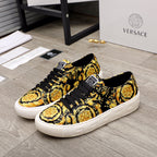 Versace luxury sneakers, black and gold baroque print, white rubber sole, lace-up