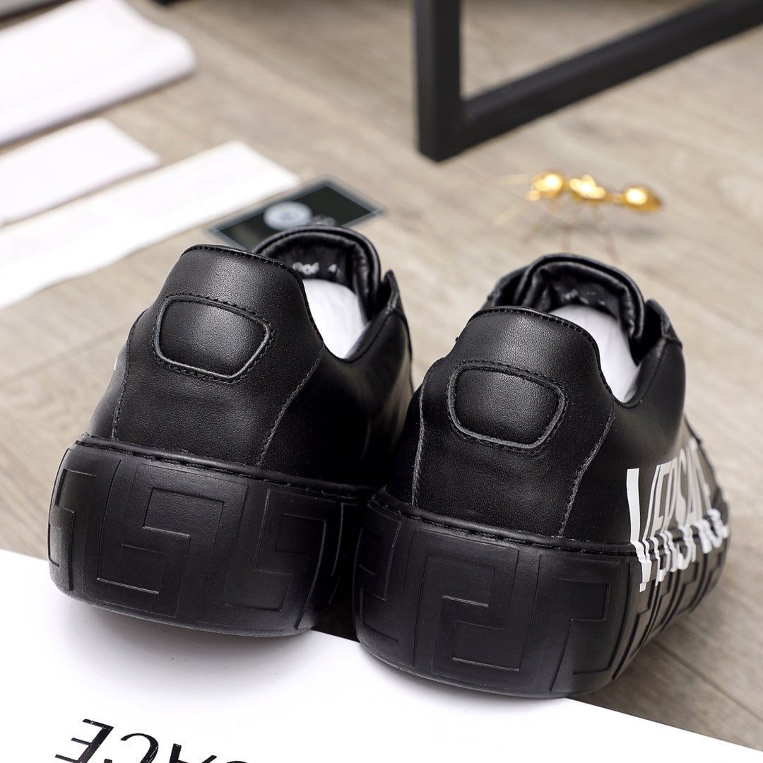 Black sneakers with cushioned heel and thick textured sole, rear view