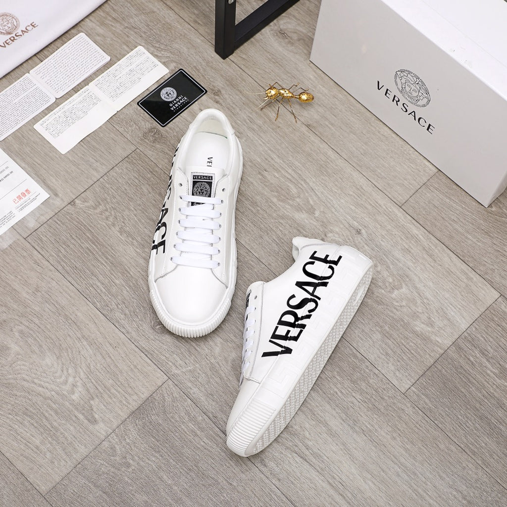 White Versace lace-up sneakers with black VERSACE logo on side