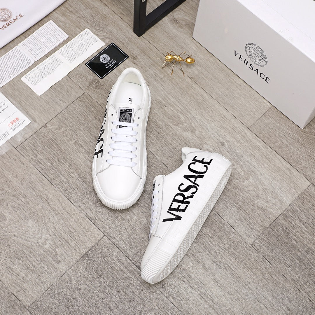 White Versace lace-up sneakers with black VERSACE logo on side