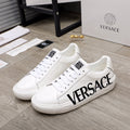 White Versace sneakers, lace-up, black VERSACE logo on side, textured sole
