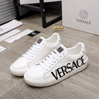 White Versace sneakers, lace-up, black VERSACE logo on side, textured sole