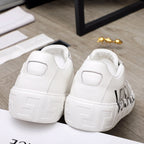 White Versace sneakers back view with thick textured sole and side logo
