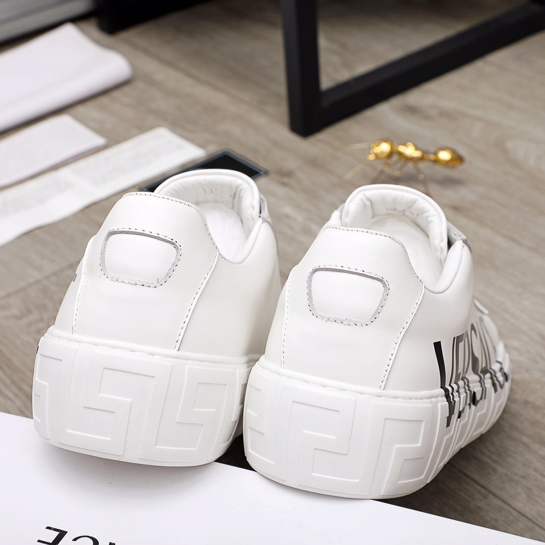 White Versace sneakers back view with thick textured sole and side logo