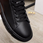 Versace black leather sneaker upper detail, black laces and stitched seams