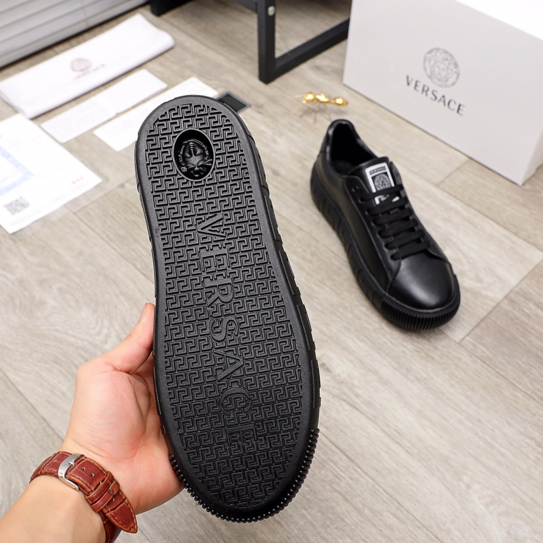 Versace black leather sneakers, outsole view with textured pattern and grip edge
