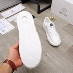 Versace white sneaker outsole view with textured tread and cushioned platform midsole