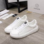 Luxury Versace white lace-up sneakers with textured platform sole and logo details