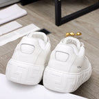Versace white sneakers rear view showing heel logo patch and chunky textured platform sole