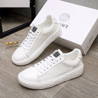 Pair of Versace white lace-up sneakers with chunky platform sole and side logo